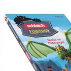 Text: "schleich Eldrador", "Diebe im Dschungel". Illustration eines grünen Drachens mit Flügeln vor blauem Himmel.