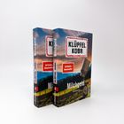 Buchtitel: "Milchgeld". Autoren: "Klüpfel Kobr". "SPIEGEL Bestseller"-Label. Zwei Bücher mit Alpenlandschaft im Hintergrund.