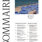 Überschrift: SOMMAIRE. Themen: Sprache, Frauenrechte, Sarkozy, Künstliche Intelligenz. Bild: Strand mit blauen Sonnenschirmen.