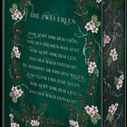 Die Texte lauten: "Die zwei Erlen. Hab Acht vor dem Grün, vor den Bäumen hab Acht..." Es ist ein Buchcover mit floralen Mustern.