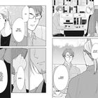 Zwei Männer im Gespräch, viele Sprechblasen. Einer hält ein Buch. Sie sitzen an einem Tisch mit Büchern im Hintergrund. Manga-Stil.