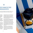 "DER GESCHMACK DER NORDSEEKÜSTE" ist der Titel; darunter eine Teekanne, Kekse und ein Tauch in gelbem Dip auf einem Tablett.