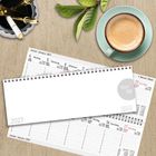 Kalender für Januar 2027, Tage und Wochen auf Deutsch und Englisch, Kaffee und Stifte auf Holzoberfläche.