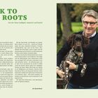 "BACK TO THE ROOTS: Von der Natur beflügelt, inspiriert und beseelt" gefolgt von einem Mann, lächelnd mit Hund im Arm.