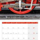 Kalenderblatt mit roter Schrift zeigt Februar 2027. Oben ist das Triebwerk einer roten Dampflokomotive sichtbar.