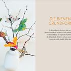 "Die Bienen-Grundform" ist zentriert neben einem Foto von Origami-Insekten auf Zweigen in einer weißen Vase.