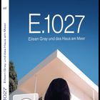 Text: "Sie baute ein Haus für sich selbst. Es wurde leider ein Meisterwerk. E.1027 Eileen Gray und das Haus am Meer."  
Frau vor modernem Gebäude.