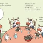 Eine Illustration zeigt drei Kühe am Tisch. Links überlegt eine Kuh mit einer Zeichnung, rechts essen zwei frisches Gras.