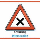 Dreieckiges Warnschild mit rotem Rand und schwarzem "X". Text: "Kreuzung" und "Intersección".