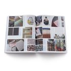 Eine offene Zeitschrift mit mehreren Bildern von Textil- und Keramikkunstwerken, begleitende blaue Textbeschreibungen.