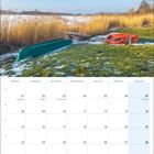 Kalenderblatt für Februar 2027. Zwei Boote liegen im schneebedeckten Gras neben einem Schilfgürtel am Ufer eines Gewässers.