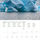 Kalenderseite für Januar 2027, mehrsprachig, mit Bild eines großen Eisbergs im Wasser unter blauem Himmel.