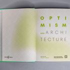 "OPTIMISM and ARCHITECTURE" in großen Buchstaben, gestaltet auf einem gemusterten Hintergrund.