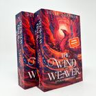 Zwei Bücher mit dem Titel "The Wind Weaver: Sturmverführt" von Julie Johnson. Ein phönixähnliches Wesen dominiert das Cover.