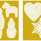 Ein goldenes Muster mit weißen Umrissen zeigt einen Nussknacker, ein Pferd, einen Schneemann, ein Herz und eine Schneeflocke.