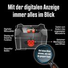 Ein schwarzes Gerät mit digitalem Münzzähler, doppeltem Boden und geheimem Öffnungsmechanismus.
