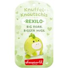 Text: "Knuffel-Knautschis Rexilo. Big Roar. Bigger Hugs." Darunter ein niedliches grünes Plüschtier, umgeben von Herzen.