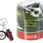 "Schlüsselanhänger, Key Rings, Porte-Clés" steht auf einer runden Verpackung. Vorne Schlüsselanhänger mit Auto und Rad.