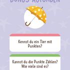 BONUS-AUFGABEN. Ein gelber Regenschirm mit weißen Punkten. Fragen: „Kennst du ein Tier mit Punkten?“ „Kannst du die Punkte zählen?“