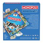 "MONOPOLY HUNDEBABYS" steht im oberen Bereich. Verschiedene niedliche Hundebilder umrahmen das Spielfeld.