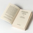 Titel: "Harlan Coben & Reese Witherspoon Ohne ein letztes Wort". Buch geöffnet, Text auf linker Seite, Titelblatt rechts.
