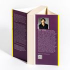 Rückseite eines Buches mit Text über Wolf Küper und seinem Reisebuch. Foto eines lächelnden Mannes. QR-Code vorhanden.