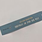 "JULIAN SANCTON: IRRENHAUS AM ENDE DER WELT" auf dem Buchrücken. Logo mit Stern bei "MALIK".