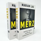 Zwei Bücher mit dem Titel "MERZ" von Mariam Lau, Untertitel: "Auf der Suche nach der verlorenen Mitte", Seitenansicht.
