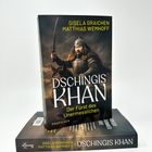Zwei Bücher: "Dschingis Khan - Der Fürst des Unermesslichen" von Gisela Graichen und Matthias Wemhoff, Cover zeigt Krieger mit Schwert.