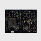 Eine reich verzierte Buchcover-Illustration mit Text: „THE SHADOW'S PACT“ von Ney Scatchter, umrahmt von goldenen Verzierungen.