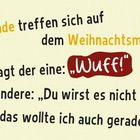 "Zwei Hunde treffen sich auf dem Weihnachtsmarkt. Sagt der eine: 'Wuff!' Illustriertes Bild mit Hund und Deko.