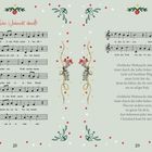 "Fröhliche Weihnacht überall!" Liednoten mit festlichen floralen Verzierungen und weihnachtlichen Ornamenten auf blassgrünem Hintergrund.