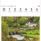 Kalender: 31 Mai, 1-6 Juni. Foto: Grüne Landschaft, Fluss, Brücke und weiße Häuser.
