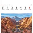Kalender mit Mai und Juni, Woche 22, 21.5.–20.6., Valley of Fire State Park, Nevada. Ein Weg durch rote Felsen, blauer Himmel.