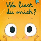 Text: "Wo liest du mich?" Illustration: Fröhliches quadratisches Gesicht mit großen Augen und einem Lächeln.