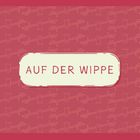 Text: "AUF DER WIPPE". Hintergrund mit wiederholtem Wippen-Muster in Rot- und Beigetönen.