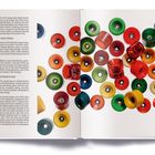 Seite eines Buches mit bunten Skateboardrollen. Texte: "Bennett Super Gator Wheels" und "Double Conical Wheels by Gyro".