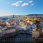 Kalenderübersicht: März in Zürich. Eine malerische Ansicht der Stadt, mit historischen Gebäuden und einem Kirchturm bei Sonnenschein.
