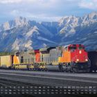 Monatskalender: März. Zug mit roter Lokomotive, Berge im Hintergrund, Tages- und Datumsanzeige unten.