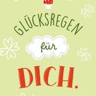 "Glücksregen für dich." Illustration mit Fliegenpilz und weißen Blumen auf grünem Hintergrund.