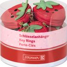 Text: „Schlüsselanhänger Key Rings Porte-Clés“. Runde Packung mit roten Figuren, die wie Erdbeeren aussehen.