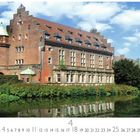 Text: "Gladbeck, Schloss Wittringen." Rotes Backsteinschloss neben einem Teich unter blauem Himmel mit weißen Wolken.