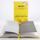 Buch mit gelbem Umschlag: "more: Mehr sexuelle Fantasien der Frauen im 21. Jahrhundert". Im Vordergrund ist das Buch geöffnet.