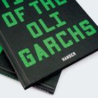 Grüner Text "OLIGARCHS" auf dunklem Hintergrund, Verlag "HANSER" unten. Rechteckiges, modernes Design mit Buchumschlagen.