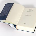 Text links: Bestimmter Inhalt über die Story. Rechts: "John Grisham, Das Vermächtnis, Roman," Verlag Heyne.