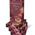 „UNMASKING Billionaires' Row, Roman, Kathinka Engel, SPIEGEL Bestseller-Autorin.“ Florales Design in Lila- und Bronzetönen.