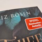 Text: "LIZ ROSEN" und "SPIEGEL Bestseller-Autorin." Hintergrund: Grüne Blätter, dunkler Hintergrund.