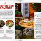 „Aromen der Provence“ steht groß geschrieben. Ein Tisch mit Wein und Speisen neben einem Fenster ist abgebildet.