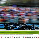 "September 2027", Formel 1 Auto, schwarz, Logos: IWG, Cadillac. Hintergrund verschwommen, Kalender unten.