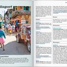 Lieblingsort: Ambositras Hauptstraße mit urigen Läden. Bild zeigt eine belebte Straße mit einem roten Auto und Passanten.